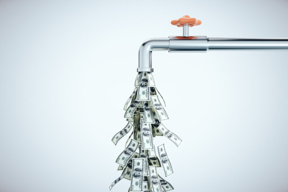 A silver faucet with an orange handle pouring out multiple dollar bills, symbolising strong cash flow.